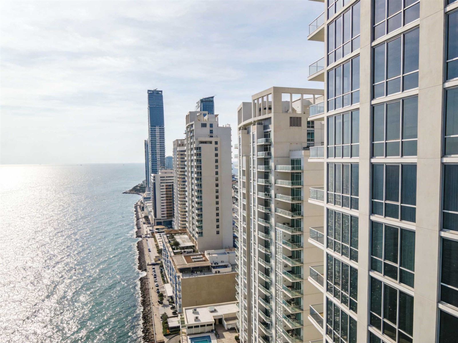 Aerial view of large coastal development with hurricane-resistant windows installed Aerial view of large coastal development with hurricane-resistant windows installed